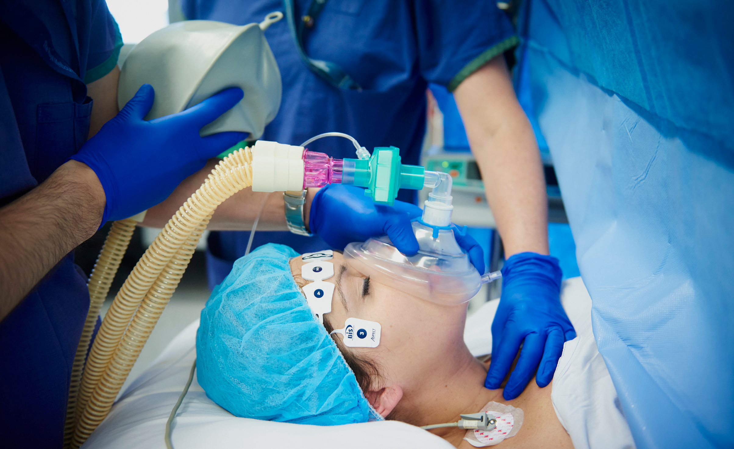 Photo of patient in hospital bed being anaesthetised