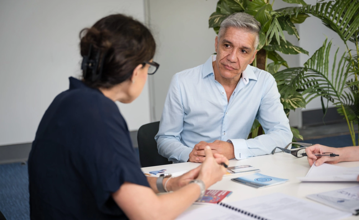 A man and a women talking in a meeting