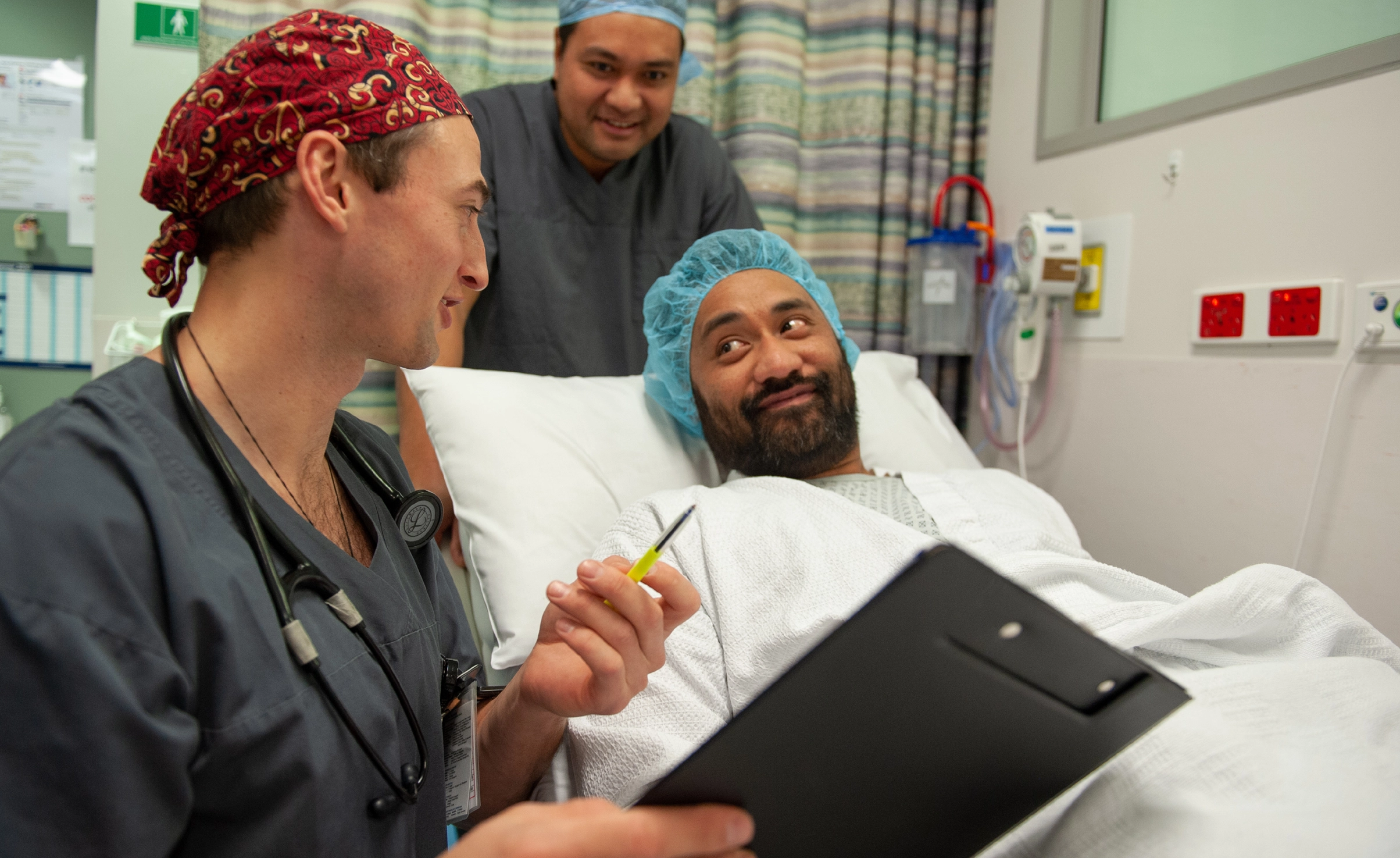 Anaesthetist talking to patient in hospital